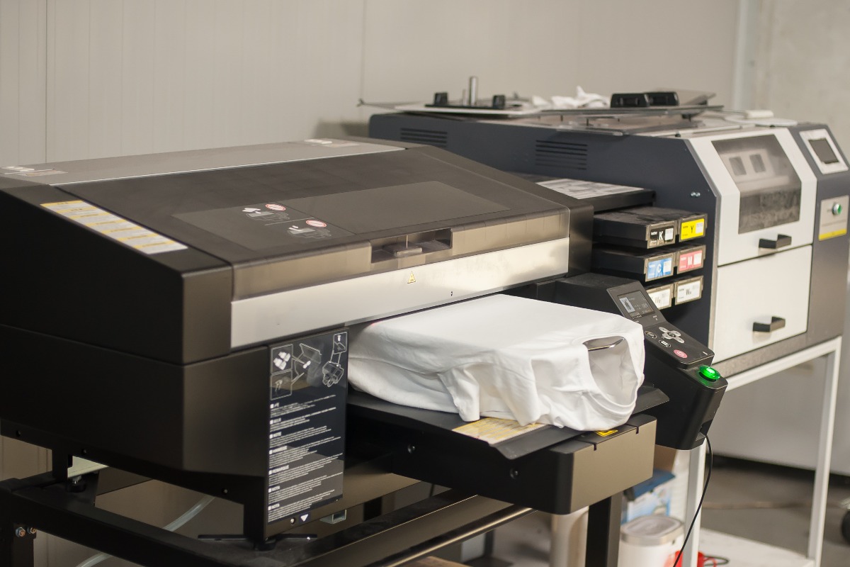 Digital t shirt printing heat press machine in printing production shop jpg
