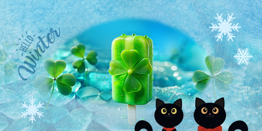 Ein grünes Eis am Stiel mit Kleeblatt zwischen Kleeblättern und zwei schwarzen Katzen
